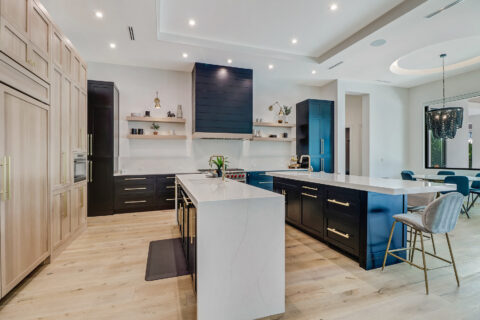 kitchen with appliances and custom cabinets