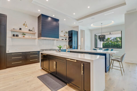 kitchen with appliances and custom cabinets