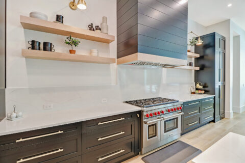 kitchen with appliances and custom cabinets