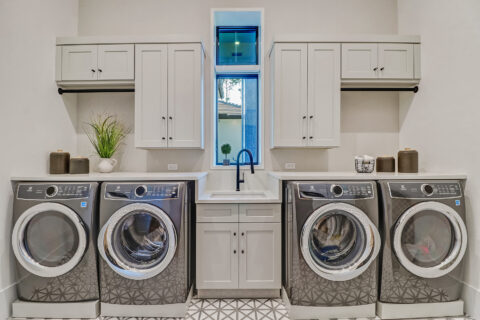 laundry room with custom closets