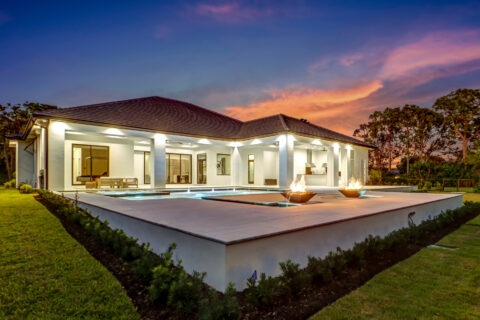 exterior of custom built home at sunset by bellamia development