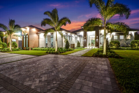 exterior of custom built home at sunset by bellamia development